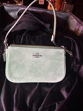 Coach Mint Green Suede Mini Wristlet converts from bag to wristlet in seconds
